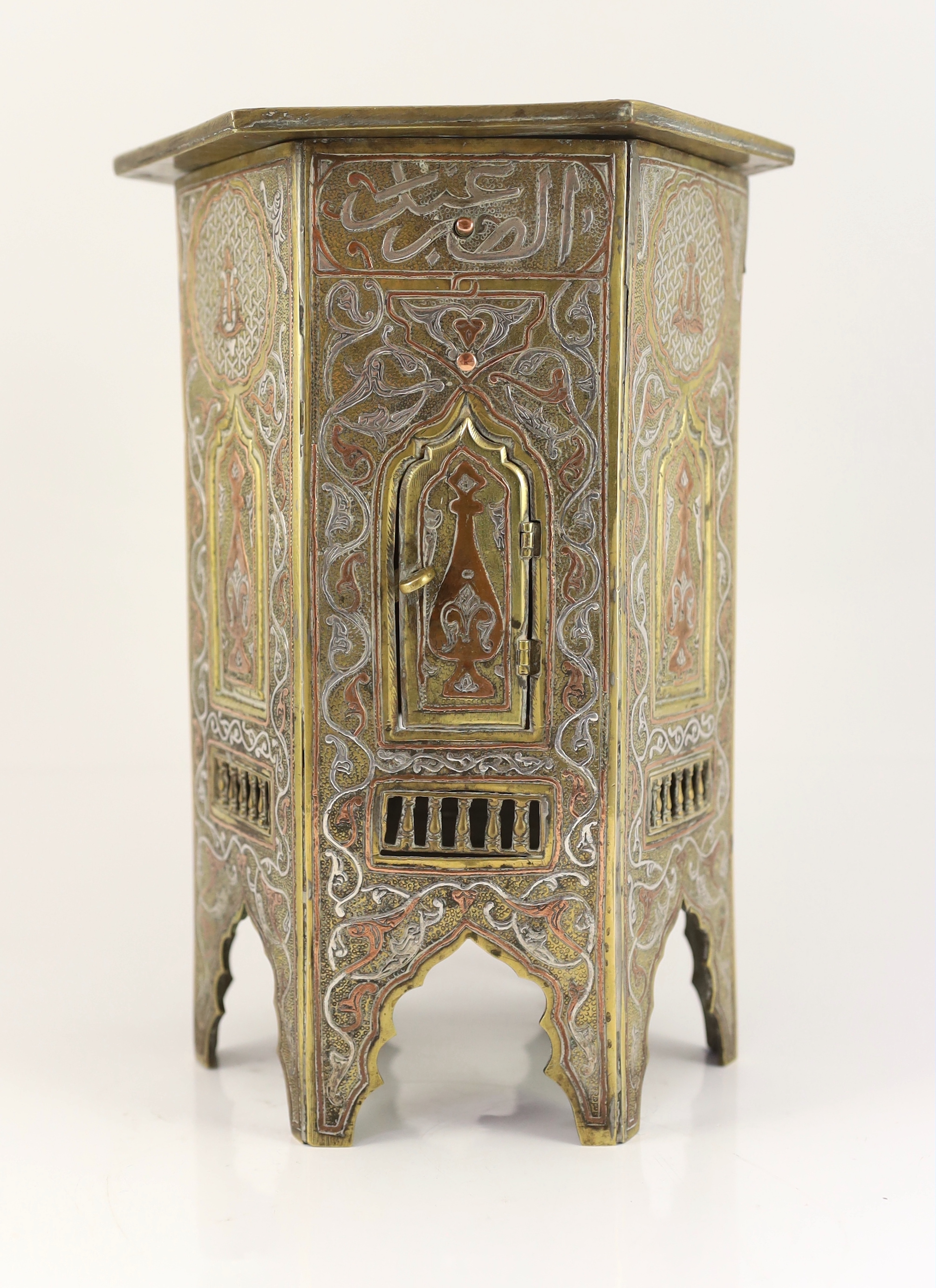 A Cairo ware silver and copper inlaid brass Qur’an stand, early 20th century